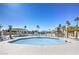 Community swimming pool area, featuring a pristine pool, pergola, and lounge chairs for relaxation at 2744 Ironside Dr, Las Vegas, NV 89108