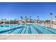 Large swimming pool with lap lanes, set in a community with palm trees and recreational facilities at 2744 Ironside Dr, Las Vegas, NV 89108