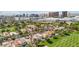 Panoramic aerial view showcasing homes adjacent to a golf course, set against the stunning Las Vegas skyline at 3177 Bel Air Dr, Las Vegas, NV 89109