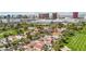 Scenic aerial view captures a residential area nestled beside a golf course with the Las Vegas skyline in the backdrop at 3177 Bel Air Dr, Las Vegas, NV 89109