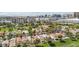 Beautiful aerial view of a golf course community with lush landscaping and the modern Las Vegas cityscape in the distance at 3177 Bel Air Dr, Las Vegas, NV 89109
