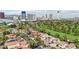 Homes with golf course views and the city skyline in the background on a clear day at 3177 Bel Air Dr, Las Vegas, NV 89109