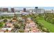 Breathtaking aerial view showcasing a community of homes near a lush golf course and the vibrant Las Vegas cityscape at 3177 Bel Air Dr, Las Vegas, NV 89109