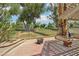 Spacious back patio boasting a fire pit and lush golf course views, perfect for outdoor relaxation at 3177 Bel Air Dr, Las Vegas, NV 89109