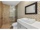 Stylish bathroom with tiled walk-in shower, modern vanity, and fixtures at 3177 Bel Air Dr, Las Vegas, NV 89109