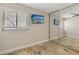 Bedroom featuring tile floors, ceiling fan, large mirror closet, and a bright window at 3177 Bel Air Dr, Las Vegas, NV 89109