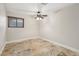 Comfortable bedroom featuring a ceiling fan, tile flooring, and neutral walls at 3177 Bel Air Dr, Las Vegas, NV 89109