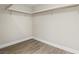 Walk-in closet features wood floors and shelving at 3177 Bel Air Dr, Las Vegas, NV 89109