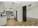 Modern kitchen featuring stainless appliances, stone countertops, and backyard views, seamlessly open to living space at 3177 Bel Air Dr, Las Vegas, NV 89109