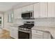 Updated kitchen with stainless steel appliances, stone countertops and plenty of cabinet space at 3177 Bel Air Dr, Las Vegas, NV 89109