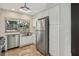 Modern kitchen with stainless steel appliances, white cabinets and subway tile backsplash at 3177 Bel Air Dr, Las Vegas, NV 89109