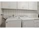 Bright laundry room featuring a new washer and dryer with plenty of storage at 3177 Bel Air Dr, Las Vegas, NV 89109
