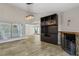 Bright living room with fireplace, built-in cabinet, and a sliding glass door to the back at 3177 Bel Air Dr, Las Vegas, NV 89109