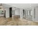 Open concept living space with tiled floors, updated kitchen, and atrium views, perfect for entertaining at 3177 Bel Air Dr, Las Vegas, NV 89109