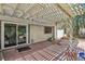 Spacious covered patio with brick flooring and sliding glass door access to the home at 3177 Bel Air Dr, Las Vegas, NV 89109