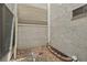 Small stone patio outside with textured walls and privacy lattice at 3177 Bel Air Dr, Las Vegas, NV 89109