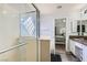 Bathroom featuring a glass shower, vanity with sink, and neutral paint colors at 3332 Beca Faith Dr, North Las Vegas, NV 89032