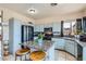 Charming kitchen with granite countertops, tile floors, black appliances, and a granite-topped island at 3332 Beca Faith Dr, North Las Vegas, NV 89032