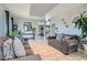 Bright living room boasts tile floors, recessed lights, comfortable seating, and a view to other rooms at 3332 Beca Faith Dr, North Las Vegas, NV 89032