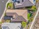 Aerial view of a home with a tile roof, manicured lawn, and outdoor patio at 35 Via Rizzuto, Henderson, NV 89011