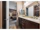 Double vanity with wood cabinets is visible through the doorway into the main bedroom at 35 Via Rizzuto, Henderson, NV 89011