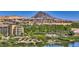 Scenic view of a lush community with a lake and mountain backdrop at 35 Via Rizzuto, Henderson, NV 89011