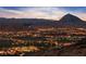 Stunning community view at dusk with homes, golf course and mountain views at 35 Via Rizzuto, Henderson, NV 89011