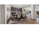 Elegant dining room boasts a large table, wood floors, and a built-in display cabinet at 35 Via Rizzuto, Henderson, NV 89011