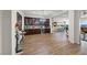 Open-concept dining and entertaining area with dark wood flooring and furniture at 35 Via Rizzuto, Henderson, NV 89011