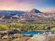 A daytime view showing the landscape, city and distant mountains at 35 Via Rizzuto, Henderson, NV 89011