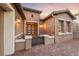 Charming front entryway with decorative brickwork and seating at 35 Via Rizzuto, Henderson, NV 89011