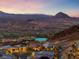 Stunning hillside home with mountain views and desert landscaping at sunset at 35 Via Rizzuto, Henderson, NV 89011