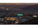 Panoramic view of hillside home showcasing desert landscape and twilight city view at 35 Via Rizzuto, Henderson, NV 89011