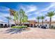 Stunning clubhouse exterior featuring a circular driveway and desert landscaping at 35 Via Rizzuto, Henderson, NV 89011