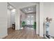 Bright foyer with decorative accents and a white front door with sidelights at 35 Via Rizzuto, Henderson, NV 89011