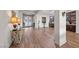 Open-concept foyer with wood floors, high ceilings, and access to kitchen and living spaces at 35 Via Rizzuto, Henderson, NV 89011