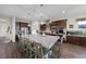 Spacious kitchen featuring an oversized island with granite countertops, ample seating, and modern appliances at 35 Via Rizzuto, Henderson, NV 89011