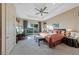 Serene main bedroom with backyard access, tray ceiling, and a comfortable seating area at 35 Via Rizzuto, Henderson, NV 89011