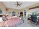 Comfortable main bedroom with ample natural light, tray ceilings, and neutral color palette at 35 Via Rizzuto, Henderson, NV 89011