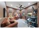 Comfortable home office features natural light, sofa, ceiling fan and dedicated workspace at 35 Via Rizzuto, Henderson, NV 89011