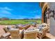 Outdoor patio area with a fire pit and seating overlooking the golf course at 35 Via Rizzuto, Henderson, NV 89011