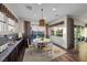 Bright sitting room with backyard view and round dining table at 35 Via Rizzuto, Henderson, NV 89011
