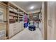 Spacious walk-in closet with custom shelving and ample storage space for clothes and accessories at 35 Via Rizzuto, Henderson, NV 89011