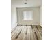 Bright bedroom features updated flooring, window with blinds, and neutral wall paint at 3735 Sand Pier St, Las Vegas, NV 89147