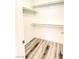 Walk-in closet includes built-in shelves and sleek vinyl flooring for maximum storage space at 3735 Sand Pier St, Las Vegas, NV 89147