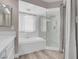 Bright bathroom features soaking tub and glass shower at 42 Megan Dr, Henderson, NV 89074