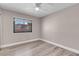 Bedroom featuring wood floors, a ceiling fan, and a window with blinds at 42 Megan Dr, Henderson, NV 89074