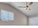 Bright bedroom features two windows and a ceiling fan at 42 Megan Dr, Henderson, NV 89074