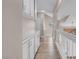 Upstairs hallway featuring built-in cabinets, white railings, and natural light, creating a cozy atmosphere at 42 Megan Dr, Henderson, NV 89074