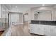 Bright kitchen offers granite countertops, white cabinets, stainless steel appliances, and an open floorplan at 42 Megan Dr, Henderson, NV 89074